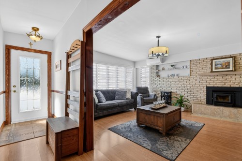 Salon - 71 45E Avenue, Saint-Eustache, QC - Indoor Photo Showing Living Room With Fireplace
