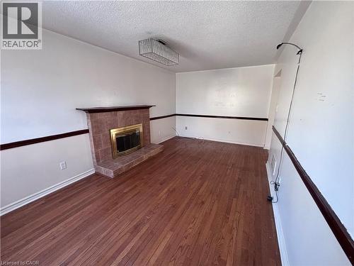 15 Strada Boulevard, St. Catharines, ON - Indoor Photo Showing Other Room With Fireplace