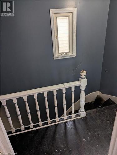 Stairway with hardwood / wood-style floors - 151 Gibson Avenue, Hamilton, ON - Indoor Photo Showing Other Room