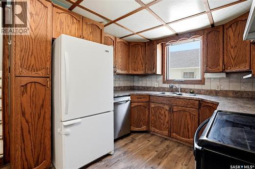 100 Cruise Street, Saskatoon, SK - Indoor Photo Showing Kitchen With Double Sink