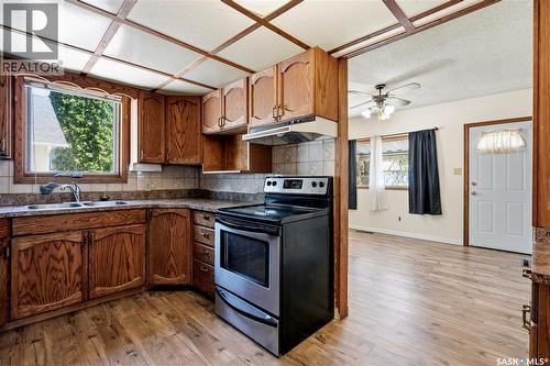 100 Cruise Street, Saskatoon, SK - Indoor Photo Showing Kitchen With Double Sink