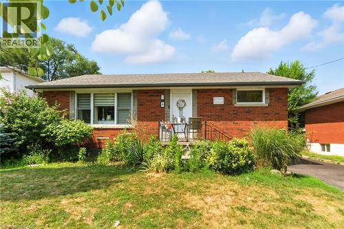 Single story home with brick siding, a front lawn, and roof with shingles - 90 Toby Crescent Unit# Lower, Hamilton, ON - Outdoor
