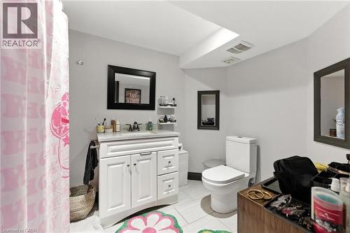 Bathroom with vanity, light tile patterned flooring, and a tub/shower - 90 Toby Crescent Unit# Lower, Hamilton, ON - Indoor Photo Showing Bathroom