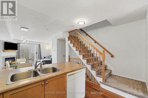 56 Steele Park Private, Ottawa, ON - Indoor Photo Showing Kitchen With Fireplace With Double Sink