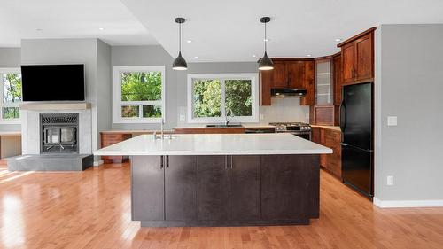 220 West Bench Drive, Penticton, BC - Indoor Photo Showing Kitchen With Fireplace With Upgraded Kitchen