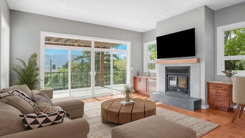 220 West Bench Drive, Penticton, BC - Indoor Photo Showing Living Room With Fireplace