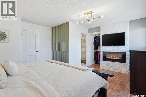 1033 9Th Street E, Saskatoon, SK - Indoor Photo Showing Bedroom With Fireplace