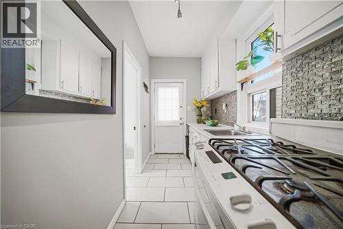 Kitchen (Main Floor). Gas Stove. - 107 Queen Street S, Hamilton, ON - Indoor