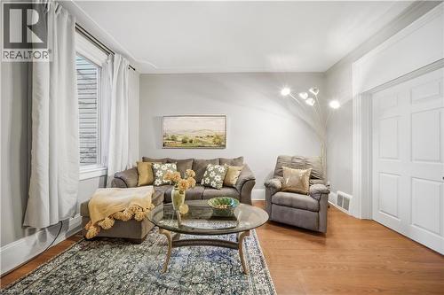 Main Floor Living Room. High Ceilings, Decorative Crown Molding - 107 Queen Street S, Hamilton, ON - Indoor Photo Showing Living Room