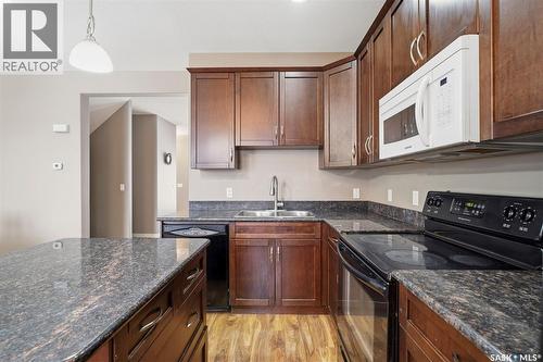 402 110 Willowgrove Crescent, Saskatoon, SK - Indoor Photo Showing Kitchen With Double Sink
