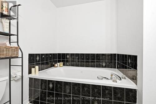 INVITING SOAKER TUB IN MAIN BATHROOM - 480 Wincanton Drive, Ottawa, ON - Indoor Photo Showing Bathroom