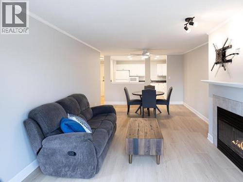 202-4685 Joyce Ave, Powell River, BC - Indoor Photo Showing Living Room With Fireplace