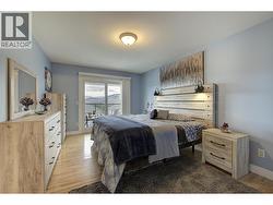 Primary Bedroom with sliding glass door to front patio - 