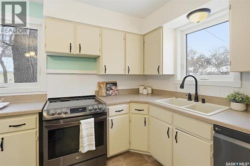 201 28Th Street W, Saskatoon, SK - Indoor Photo Showing Kitchen With Double Sink