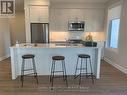 105 - 130 Boundstone Way, Ottawa, ON  - Indoor Photo Showing Kitchen With Double Sink 