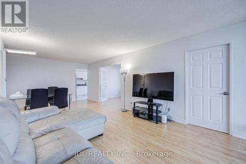 1106 - 1 Reidmount Avenue, Toronto, ON - Indoor Photo Showing Living Room