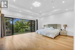 Primary Bedroom.10ft ceiling w/out to balcony - 