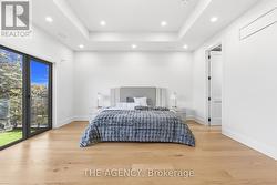 Primary Bedroom.10ft ceiling w/out to balcony - 