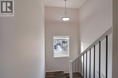 Top Landing looking westerly - 322 17 Street E, Brooks, AB - Indoor Photo Showing Other Room