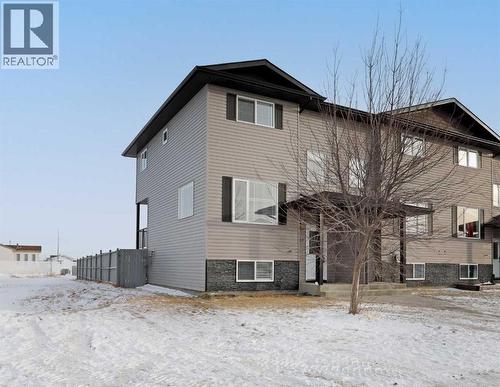 End Unit - North Side View - 322 17 Street E, Brooks, AB - Outdoor With Exterior