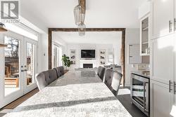 Wood beam accents & cambria quartz countertops - 