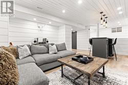 Knotty pine shiplap & potlight T/O basement - 