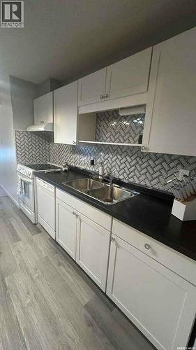 137 209D Cree Place, Saskatoon, SK - Indoor Photo Showing Kitchen With Double Sink