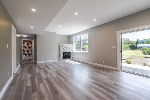 180 Hollywood Crescent, Lillooet, BC - Indoor Photo Showing Living Room With Fireplace