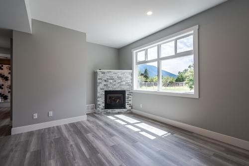 180 Hollywood Crescent, Lillooet, BC - Indoor Photo Showing Living Room With Fireplace