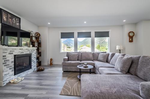 180 Hollywood Crescent, Lillooet, BC - Indoor Photo Showing Living Room With Fireplace