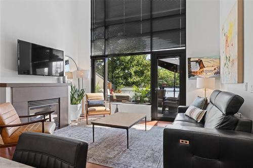 205-600 Sarsons Road, Kelowna, BC - Indoor Photo Showing Living Room With Fireplace