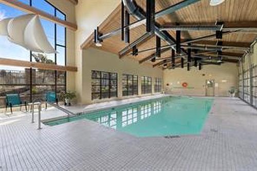 205-600 Sarsons Road, Kelowna, BC - Indoor Photo Showing Other Room With In Ground Pool