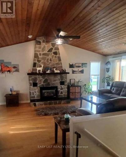 7652 Harris Point Drive, Plympton-Wyoming, ON - Indoor Photo Showing Living Room With Fireplace