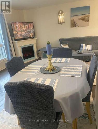 246 Romulus Private, Ottawa, ON - Indoor Photo Showing Dining Room With Fireplace