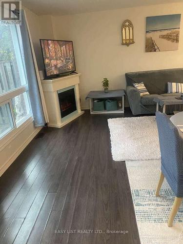 246 Romulus Private, Ottawa, ON - Indoor Photo Showing Living Room With Fireplace