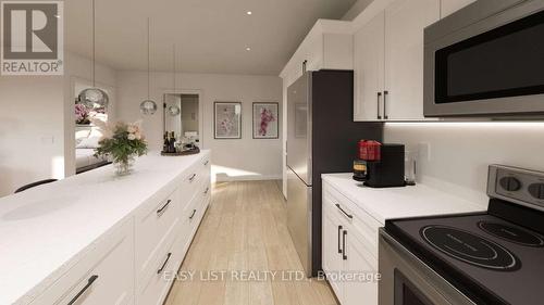 102 - 20 Green Arbour Way, Kawartha Lakes, ON - Indoor Photo Showing Kitchen