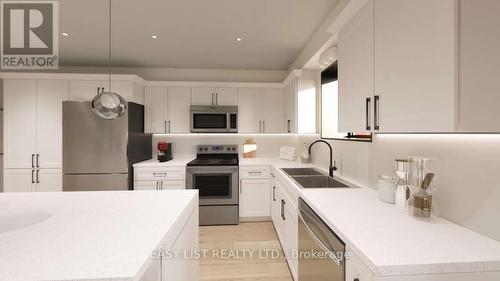 102 - 20 Green Arbour Way, Kawartha Lakes, ON - Indoor Photo Showing Kitchen With Double Sink