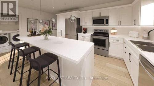 102 - 20 Green Arbour Way, Kawartha Lakes, ON - Indoor Photo Showing Kitchen With Double Sink