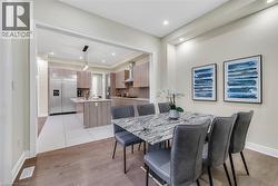 Dining space with light wood-type flooring and recessed lighting - 
