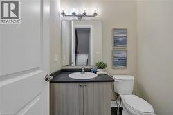 Half bathroom with vanity and toilet - 
