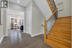 Staircase featuring wood finished floors and recessed lighting - 