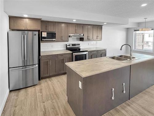 57 Cobalt Crescent, Brandon, MB - Indoor Photo Showing Kitchen With Double Sink