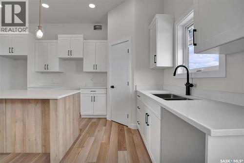 220 Veterans Drive, Warman, SK - Indoor Photo Showing Kitchen With Double Sink