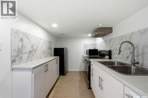 414 18Th Avenue, Regina, SK - Indoor Photo Showing Kitchen With Double Sink