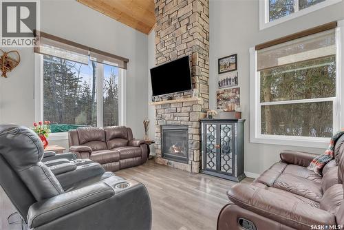 102 Moore Drive, Christopher Lake, SK - Indoor Photo Showing Living Room With Fireplace