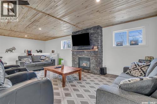 102 Moore Drive, Christopher Lake, SK - Indoor Photo Showing Living Room With Fireplace