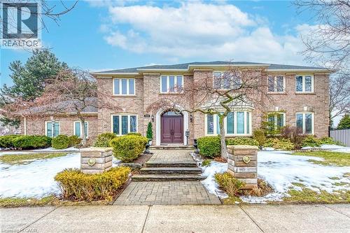 View of front facade featuring brick siding - 4220 Millcroft Park Drive, Burlington, ON - Outdoor With Facade