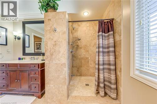 Bathroom featuring vanity, a shower stall, and crown molding - 4220 Millcroft Park Drive, Burlington, ON - Indoor Photo Showing Bathroom