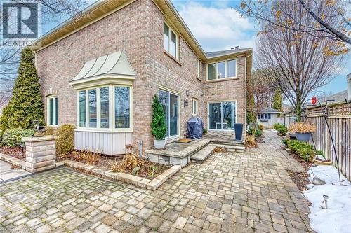 Rear view of house featuring a patio and brick siding - 4220 Millcroft Park Drive, Burlington, ON - Outdoor With Deck Patio Veranda