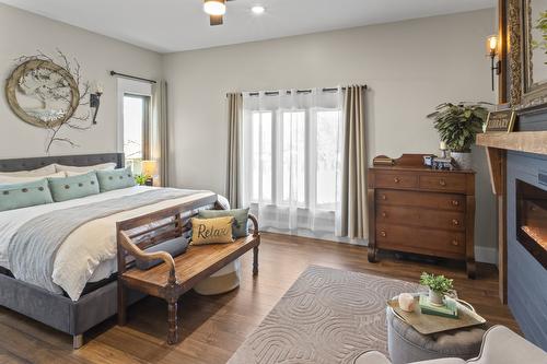 323 Canyon Street, Creston, BC - Indoor Photo Showing Bedroom With Fireplace